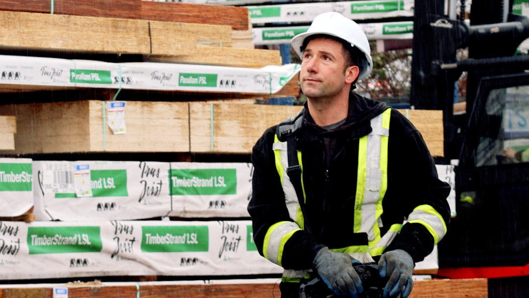 Standard Building Supplies crane operator Jesse Gale delivering building materials to a construction site in Metro Vancouver